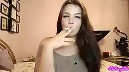 XO Bunny blows smoke in your face while smoking her cigarette.