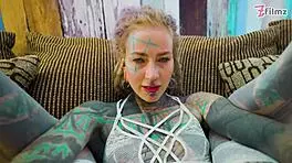 Tattoo girl feels pleasure in solo anal play with big dildo in sexy fishnets