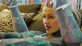 Tattoo girl feels pleasure in solo anal play with big dildo in sexy fishnets