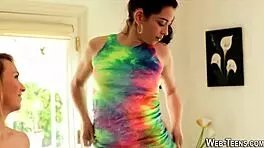 Petite teen lesbian performs oral on another girl in 69 position