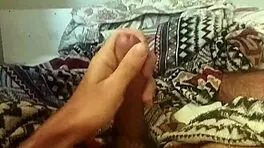 Handsome Brazilian Guy Masturbates Lying Down with Huge Cock and Spread Legs