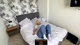 young blonde with glasses rides cock in this amateur couple scene