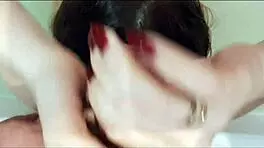 she jerks off a dick in the bathroom, getting cum on her hair as a cool mask.