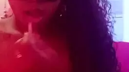 A sexy teen brunette Latina sensualizes for her fans in an ebony performance