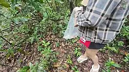 thai girl chats while picking mushrooms in the forest 😊