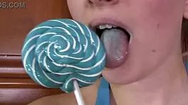 brunette sucks on lollipop in high heels