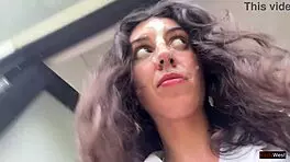 Enjoying a mouthful of pizza on the street in a public cafe with beautiful teen