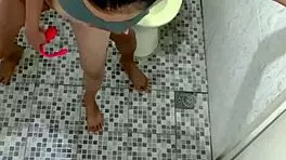 in the public toilet, a young woman experiences intense orgasms on cctv
