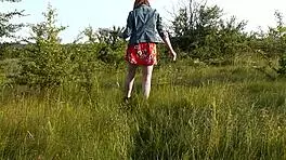 Cute brunette student flashes at wild beach in short dress