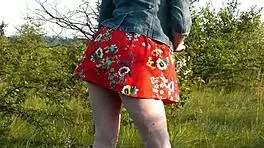 Cute brunette student flashes at wild beach in short dress