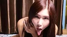 april maxima sucking a dildo before she gives it a footjob