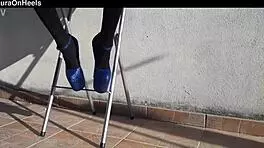 Denim shorts, black tights, and gorgeous heels on adorable milf