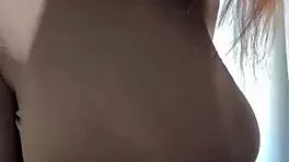 woman caresses her milky tits until she orgasms