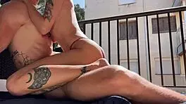 quietly cumming on the balcony as neighbors watch