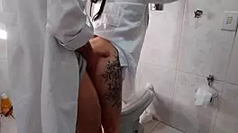 Nurse interacts with doctor in hospital bathroom