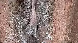 Is this ebony woman masturbating in her room alone?