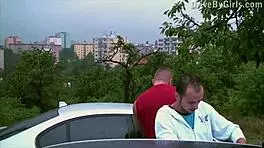 a girl shoves her butt through the car window for public orgy fucking