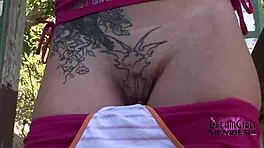 hey, check out this tattooed wild girl stripping completely nude in the local park, so exciting!