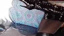 brunette milf in total black fishnets pantyhose and over the knee boots