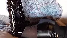 brunette milf in total black fishnets pantyhose and over the knee boots