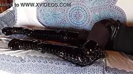 brunette milf in total black fishnets pantyhose and over the knee boots