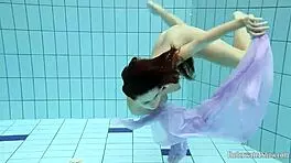 Blackhaired Aneta Relaxing In The Pool