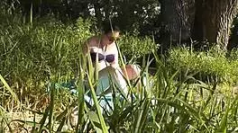 what happens when a young brunette babe masturbates in nature outside the house in public on the beach