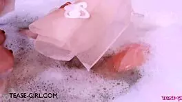 enchanting brunette muse enjoys a sensual bath