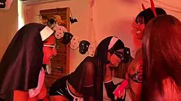 halloween lesbian party with a devil, nuns, and witch kissing