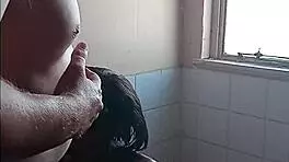 in the bathroom, she gives a passionate blowjob