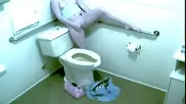 Hot blonde office babe fingers herself wildly on hidden toilet cam