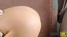 creating stunning artwork on the sofa with a beautiful blonde!