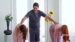 yoga trainer stretches flexible clients in ignore training sessions