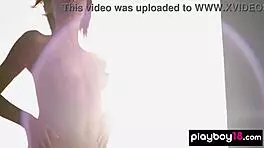 Skinny brunette Ariel boldly strips bikini exposing small tits shaved pussy outdoors