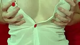 Pretty blonde teases huge tits in see-through dress close-up amateur