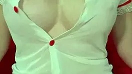 Pretty blonde teases huge tits in see-through dress close-up amateur