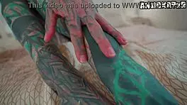 heavily inked goth teen fucks herself deep with huge dildo on bed