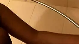 hey check out this young ebony babe showing off her wet pussy in the shower