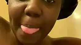 hey check out this young ebony babe showing off her wet pussy in the shower