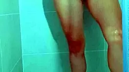 College stunner slips off Brazilian thong in steamy shower tease