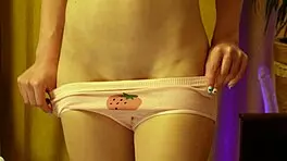 blonde beauty dances in strawberry panties hugging her round ass