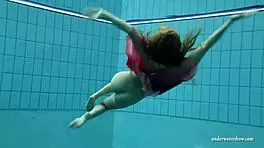 silvie dives in pool showing off her big tits and hairy pussy