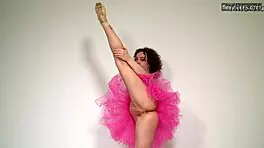 curly russian gymnast stretches naked on sofa showing flexible legs and pussy