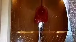 Appetizing ass girl spreads wide for pink toy fun in steamy shower.