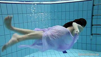 Blackhaired Aneta Relaxing In The Pool