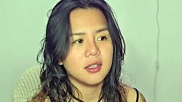 asian teen amateur gets excited by homemade music track