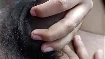 desi hottie strokes cock with feet while buzzing on bed